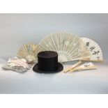 A mixed textile lot to include a brushed velvet top hat, various gloves and four brise fans