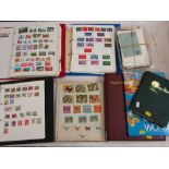 Five albums containing a collection of mixed stamps, a stockbook containing British stamps and an