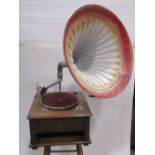 A vintage oak table top gramophone in oak, with painted horn and a King sound box