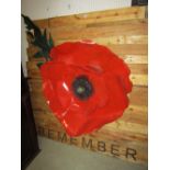 A large contemporary bespoke painted cut sheet metal remembrance study of a poppy mounted on a