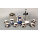 A six place Royal Doulton coffee set of small proportions with gilded cartouches containing exotic