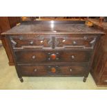 An Edwardian chest of two long and two short drawers with block moulded detail, 107cm wide