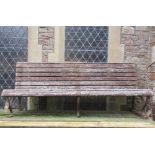 A long garden/park bench, with weathered timber lathes and sprung steel supports, 200cm long approx