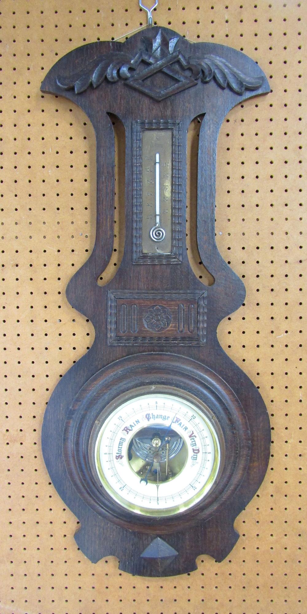 Arts and crafts type oak barometer/ thermometer, 76cm high