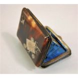 An aesthetic period tortoiseshell and silver mounted purse with segmented interior
