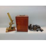 19th century mahogany cased brass microscope together with two vintage pairs of binoculars (3)