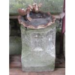 A weathered cast composition stone pedestal of octagonal form with Gothic tracery detail, later