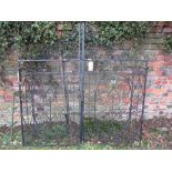 A pair of iron work entrance gates, profusely decorated with scrollwork detail, approx 170cm wide