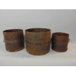 A set of three graduated steel twin handled banded vessels, the largest 19cm high (3)