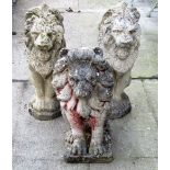 A pair of weathered cast composition stone garden ornaments in the form of seated lions, together