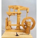 A carved wooden automaton of a working engine