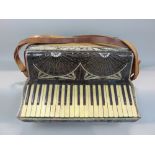 A cased Soprani piano accordion