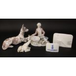 A Lladro model of a recumbent great dane, 31cm tall, a Lladro figure of a boy in 18th century