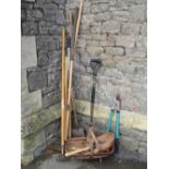 A small collection of contemporary, mainly long handled, gardening tools together with three