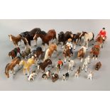 A collection of various ceramic horses including a Melba ware mare and foal, an unmarked group of