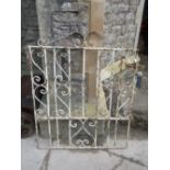 Two sections of reclaimed iron work railing with central scrollwork panels, the longest 205cm long