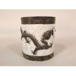 A 19th century oriental crackle glazed vase of cylindrical form with relief moulded dragon and