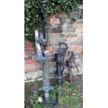 A reclaimed cast, possibly bronze, scullery water pump, together with two further cast iron examples