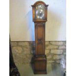 An Edwardian/1920s grandmother clock, the oak case with applied beaded and further mouldings, arched