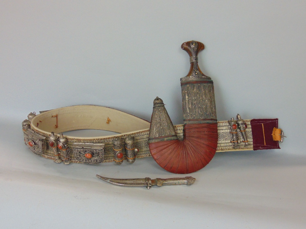 A Jambiya, the silvered cased work with wire work decoration and lather detail, accompanied by an