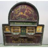 A painted vintage wooden wall mounted sign board of rectangular stepped arched form with toy shop