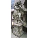 A weathered contemporary cast composition stone garden ornament/statue in the form of a romantic