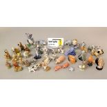 An extensive collection of Wade pottery figures including Disney characters, Tom & Jerry,