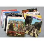 A collection of 13 Beatles vinyl LPs including Magical Mystery Tour, Please Please Me (mono)