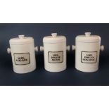 A set of three white glazed two handled drugs jars and covers, with printed contents labels, 28cm