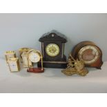 A collection of eight various clocks to include a black slate example
