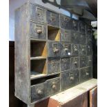 A 19th century run of drawers, originally to hold 27 graduated drawers, (2 missing), 110 cm wide