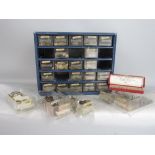 A small cabinet of 25 drawers containing a very useful collection of spare parts for jewellery and
