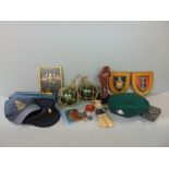 A miscellaneous collection of items relating to the Royal Marines, including a resin figure of a