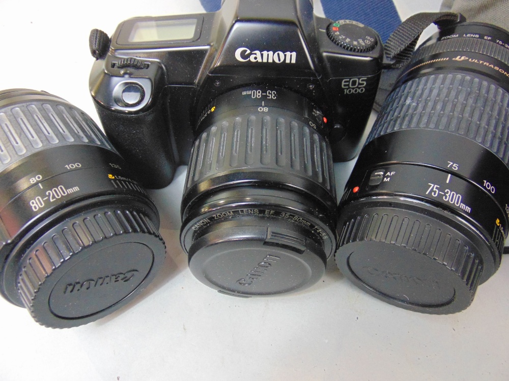 A collection of camera and photography equipment to include a Canon EOS 1000 with additional lens - Image 2 of 5