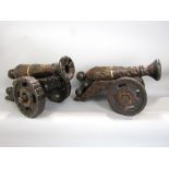 Two decorative continental, probably Spanish, canons in pine, 50cm max