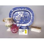 A collection of blue and white willow pattern printed wares including a meat plate, oval serving