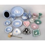 A collection of Wedgwood jasperwares including a lilac ground urn shaped vase and circular dish, a