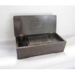Late 19th century rosewood and ebonised music box case, the hinged lid inlaid with a floral spray,