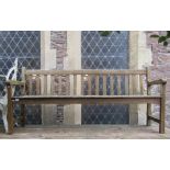 A weathered teak three to four seat garden/park bench with slatted seat and back, 6ft long