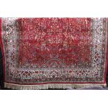 Kashmir 'Tree of Life' rug on a red ground, 240 x 160cm