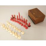 A 19th century turned bone chess set in a white and red colourway, 7cm max complete