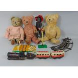 Vintage toy collection including three teddy bears, all with stitched noses and articulating