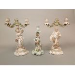 A pair of 19th century continental two branch candelabra with applied of male and female harvester