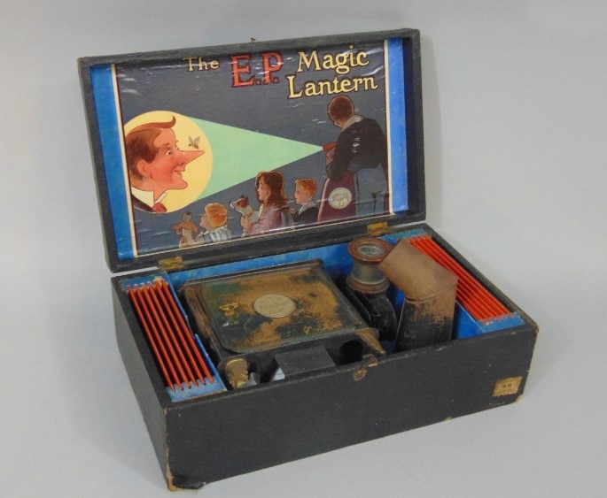 'The E.P. Magic Lantern' tin plate projector complete in original box with twelve coloured glass