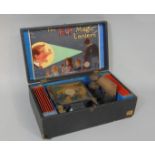 'The E.P. Magic Lantern' tin plate projector complete in original box with twelve coloured glass