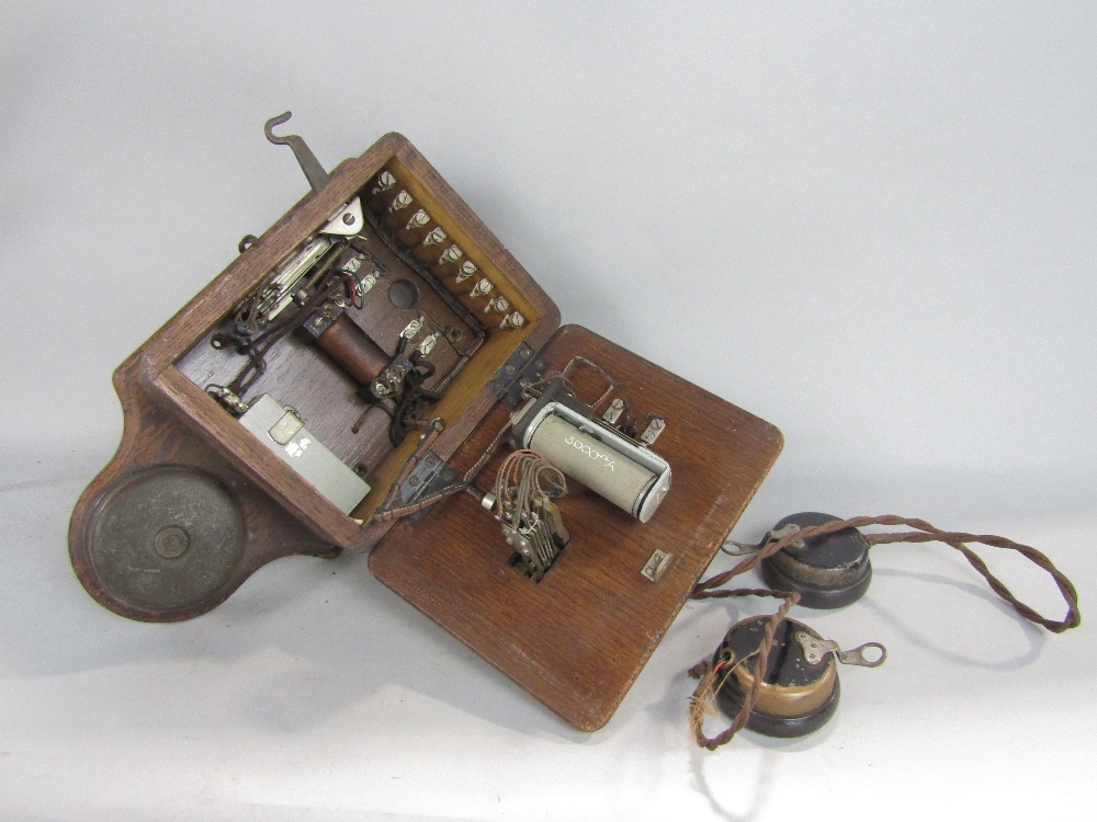 A pair of early wall mounted telephone receivers, oak cased with enamelled panels detailing the - Image 3 of 3