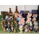 A collection of Wade pottery wares including a family of five Nat West pigs, a group of the three