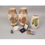 A pair of early 20th century Satsuma vases with painted male character and floral decoration, 24.5