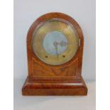 A burr walnut twin train arched case mantle clock by Johnstone of Prescot, the brass chapter ring