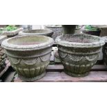 Five matching weathered cast composition stone garden planters of circular tapered form with